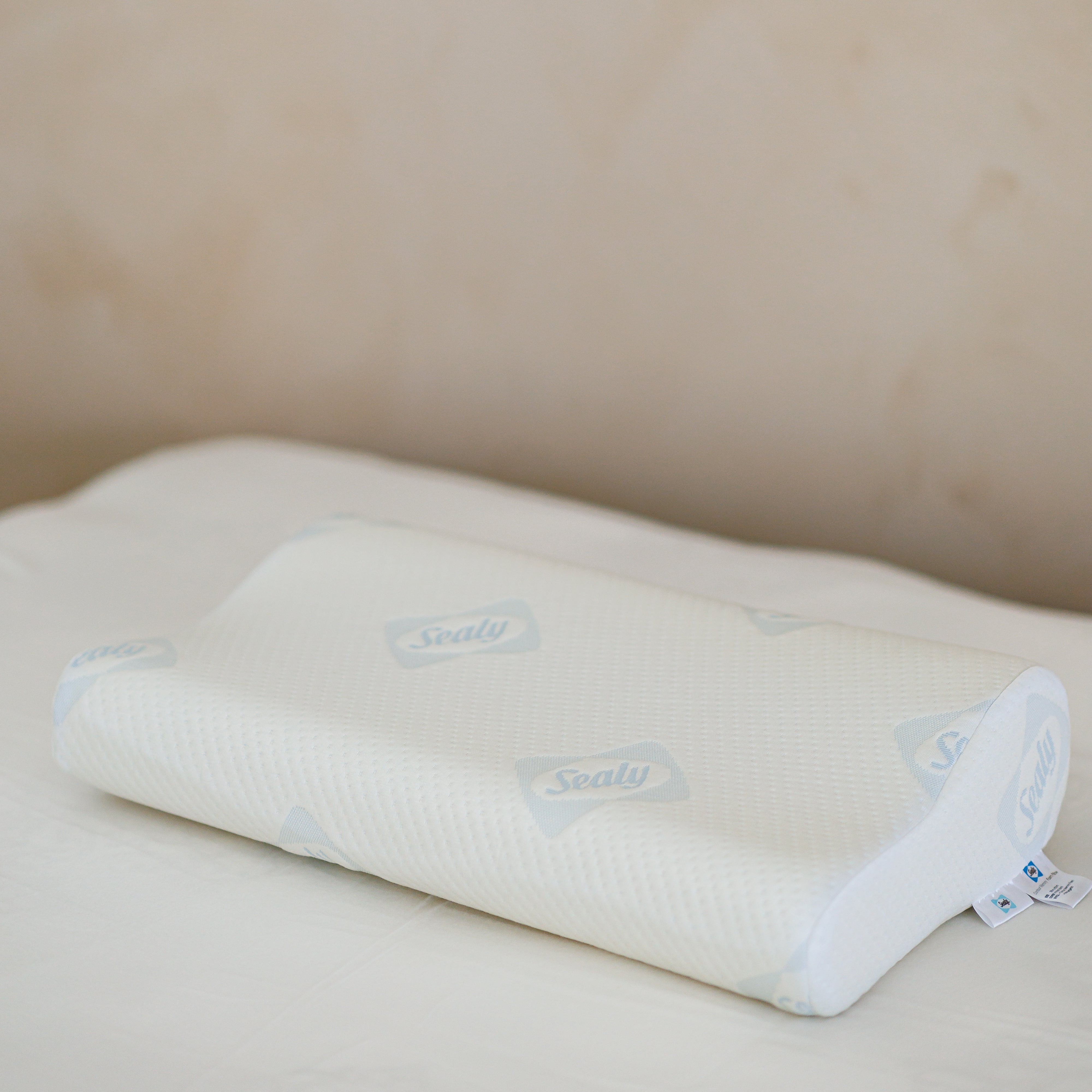 White memory foam
pillow on a beige surface