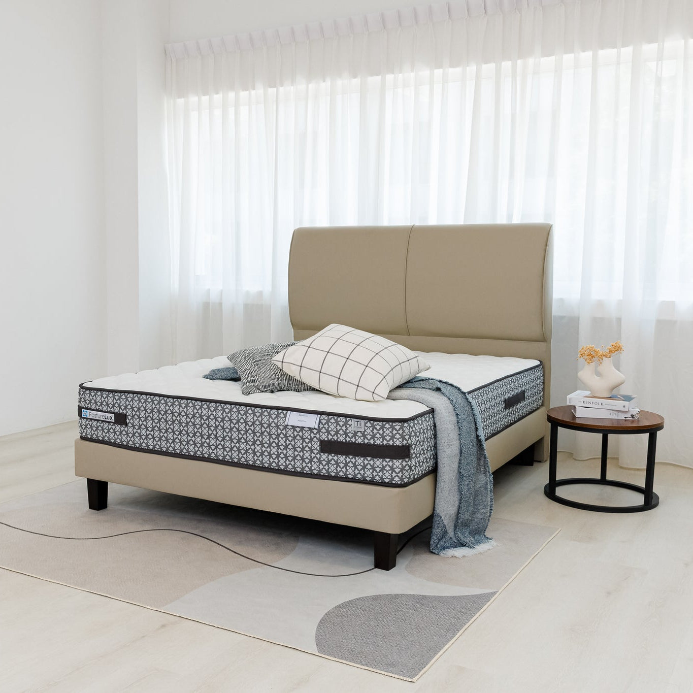 Beige bed with mattress in a minimalistic bedroom setting
